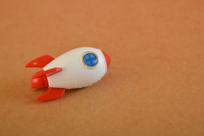 toy-rocket-isolated-on-a-brown-background-start-u-2023-05-12-03-32-29-utc